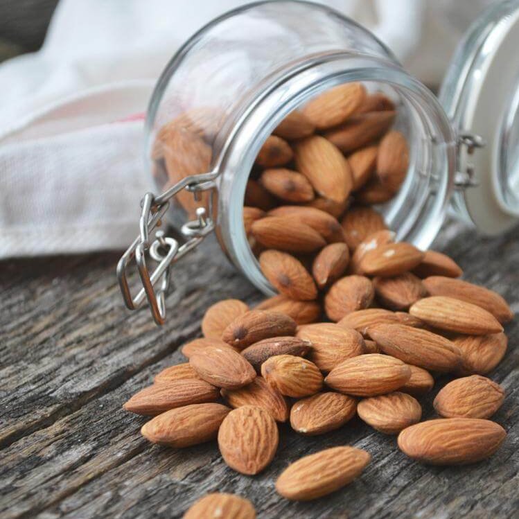 Jar of magnesium-rich whole healthy almonds