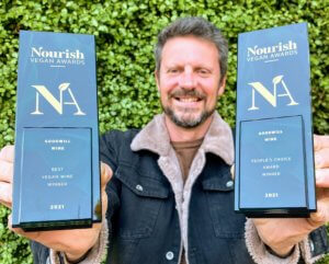 David Laity, CEO of social enterprise Goodwill Wine, with his two Nourish Vegan Awards trophies for Best Vegan Wine and People's Choice 2021