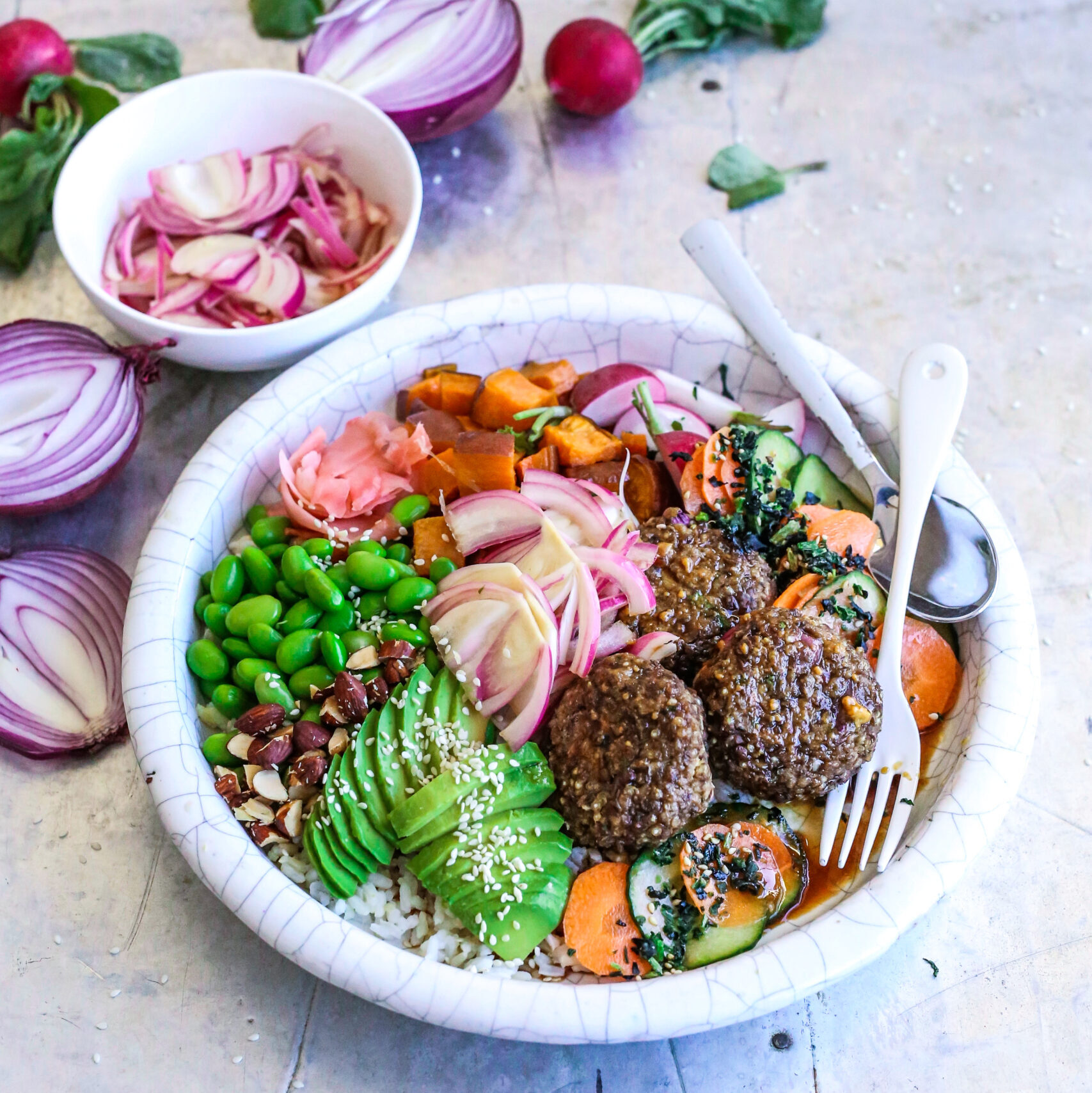 Jacqueline Alwill Teriyaki no-meatballs with rainbow veggies and kimchi / kraut lunch bowl on wooden table benchtop